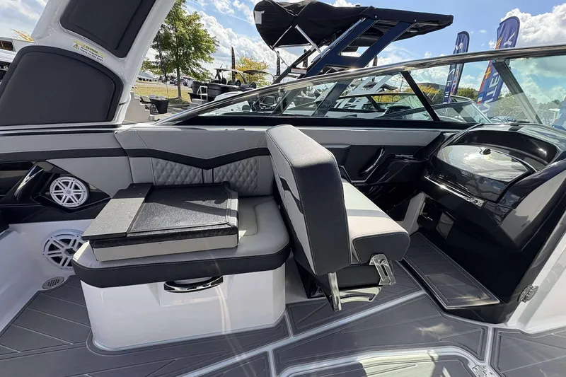 Slide: The Image of 2026 Monterey 275SS Super Sport boat interior with modern seating and sleek dashboard design. - 11