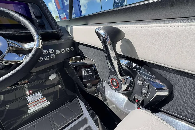 Slide: The Image of Interior of 2026 Monterey 275SS Super Sport boat, featuring steering wheel and control panel. - 13