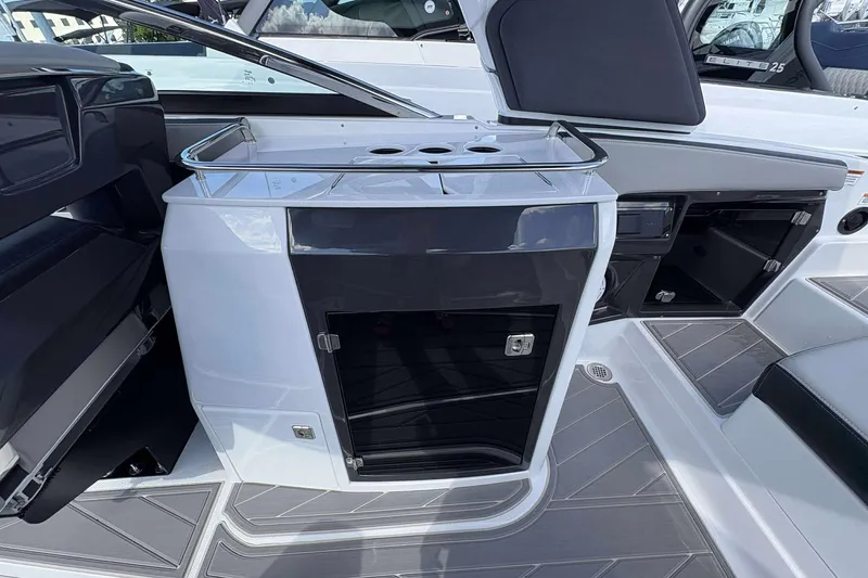 Slide: The Image of 2026 Monterey 275SS Super Sport boat interior with sleek cabinetry and modern design. - 14