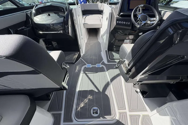 Slide: The Image of Interior of 2026 Monterey 275SS Super Sport boat with modern seating and steering wheel. - 20