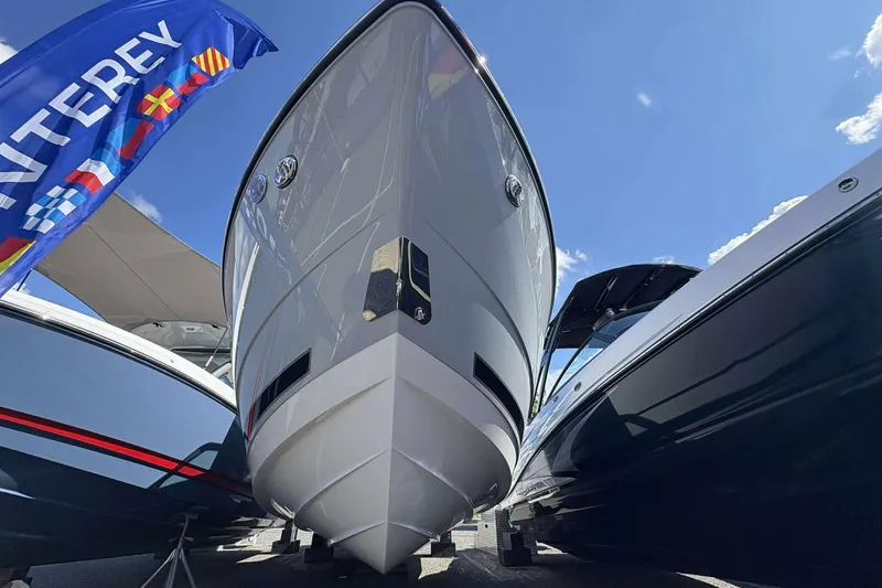 Slide: The Image of 2026 Monterey 275SS Super Sport boat displayed under a clear blue sky. - 27