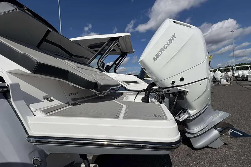 Slide: The Image of 2026 Monterey 275SS Super Sport boat with Mercury outboard engine, docked under a clear sky. - 28