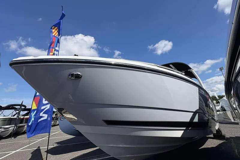 Slide: The Image of 2026 Monterey 275SS Super Sport boat displayed under a clear blue sky. - 4