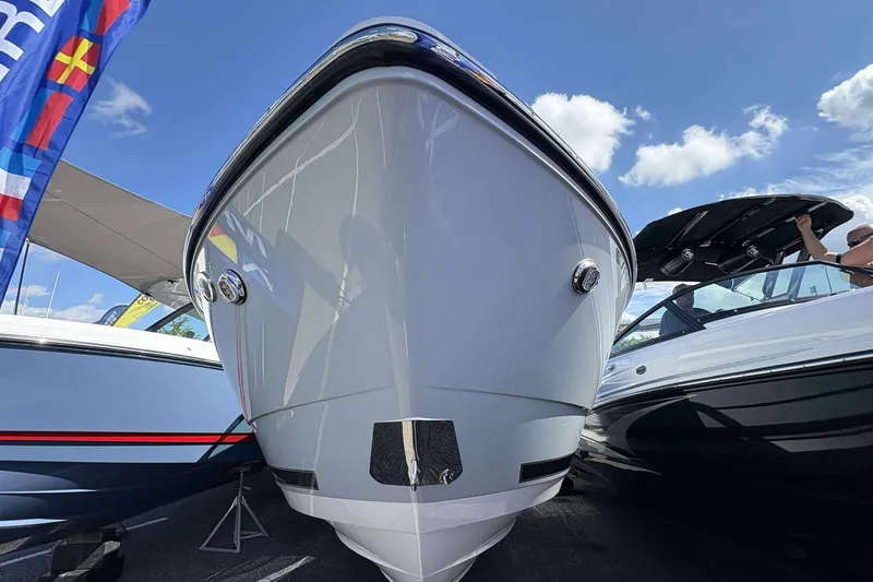 Slide: The Image of 2026 Monterey 275SS Super Sport boat showcased under a clear blue sky. - 6