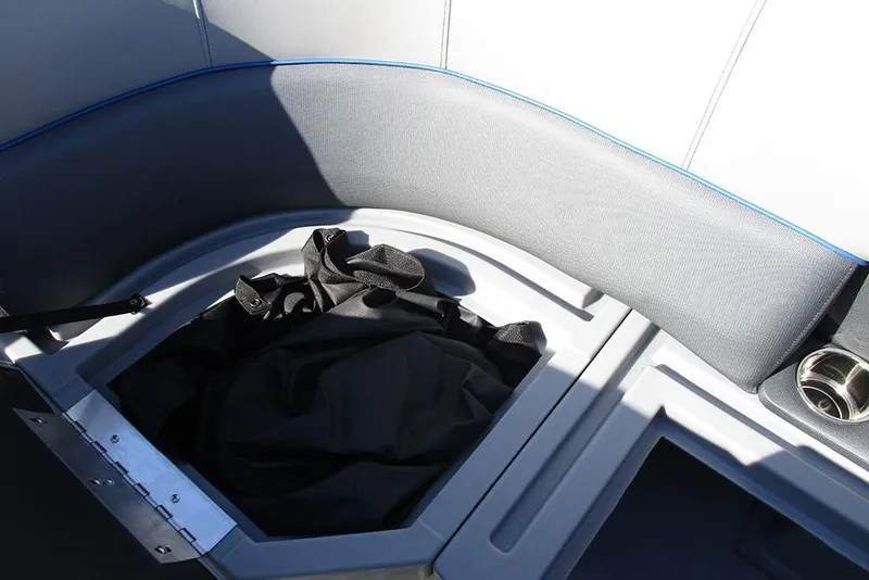 Slide: The Image of 2026 Bentley Pontoons 223 Bolt interior storage compartment with seating and cup holder. - 14
