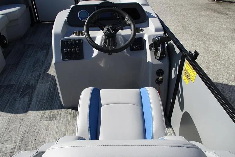 Slide: The Image of 2026 Bentley Pontoons 223 Bolt steering console with modern controls and seating. - 29
