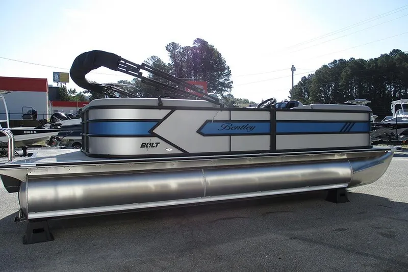 Slide: The Image of 2026 Bentley Pontoons 223 Bolt pontoon boat with sleek design and blue accents. - 7