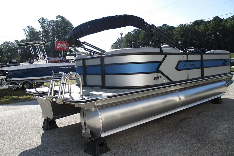 Slide: The Image of 2026 Bentley Pontoons 223 Bolt pontoon boat with sleek design and blue accents. - 8