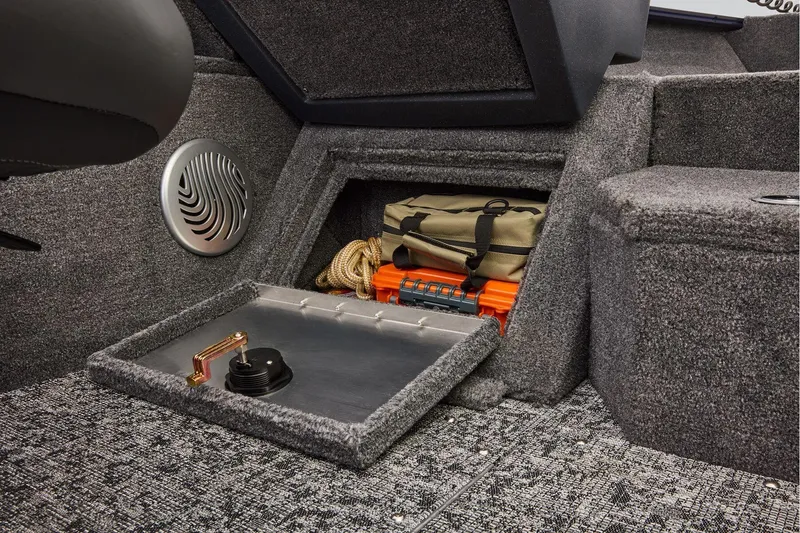 Slide: The Image of Manufacturer Provided Image: 2026 Tracker Pro Guide V-175 WT boat storage compartment with gear and speaker. - 36