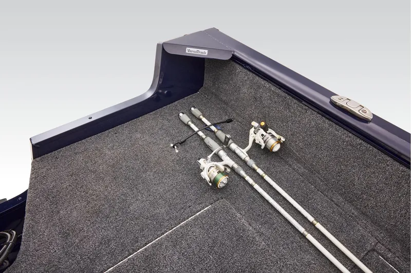 Slide: The Image of Manufacturer Provided Image: 2026 Tracker Pro Guide V-175 WT boat interior with fishing rods on carpeted floor. - 41