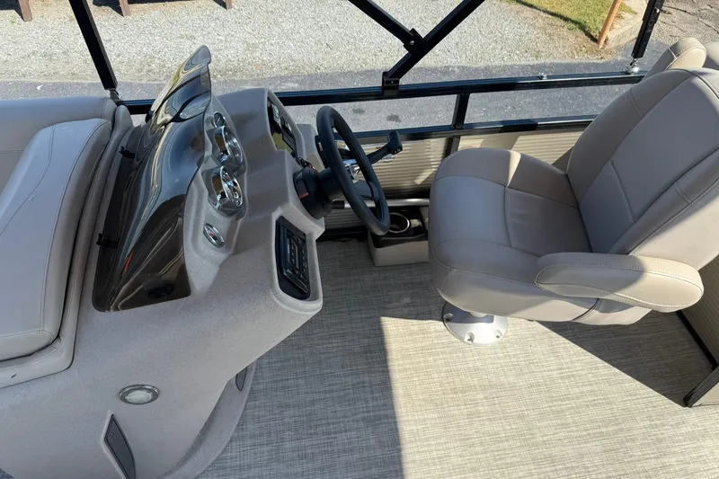 Slide: The Image of 2018 Avalon GS Cruise II boat interior with steering console and captain's chair. - 11