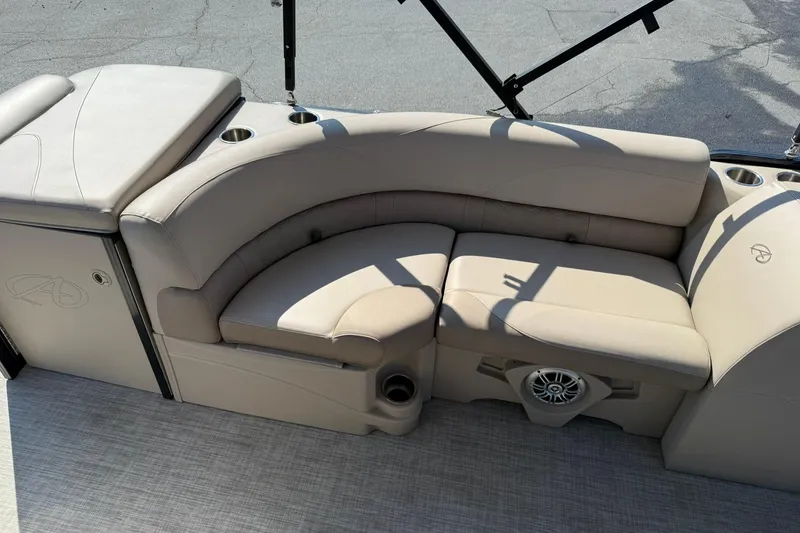 Slide: The Image of 2018 Avalon GS Cruise II 19' boat interior with beige seating and cup holders. - 15