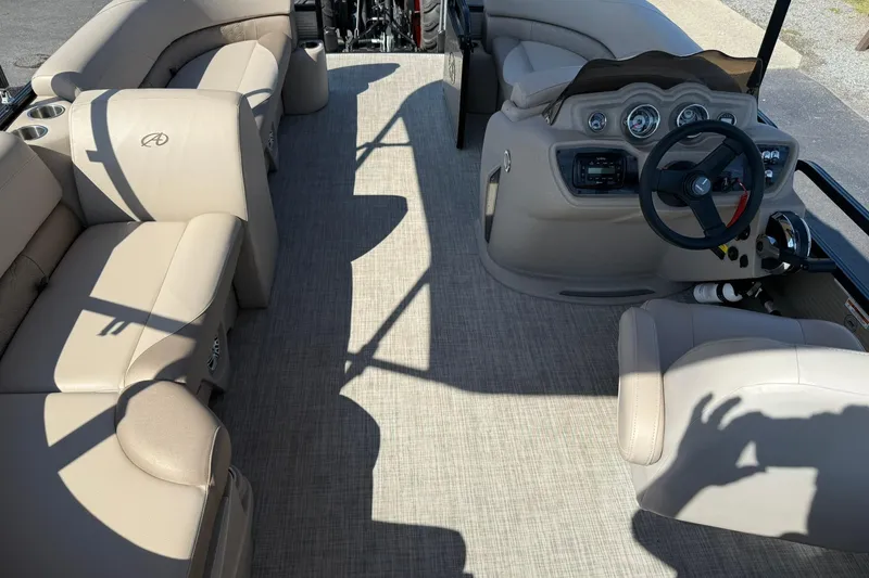 Slide: The Image of Interior of 2018 Avalon GS Cruise II boat with beige seating and steering console. - 17