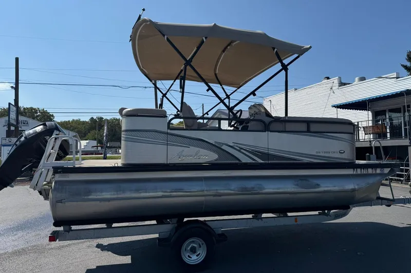 Slide: The Image of 2018 Avalon GS Cruise II 19' pontoon boat with canopy on trailer. - 5