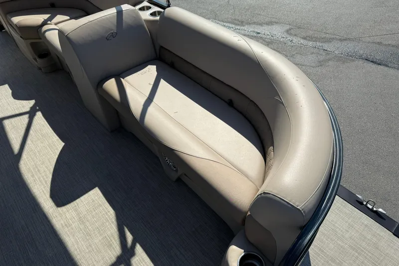 Slide: The Image of 2018 Avalon GS Cruise II boat with beige seating and cup holders. - 8