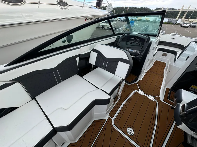 Slide: The Image of 2022 Monterey 258 Super Sport boat interior with sleek seating and modern dashboard design. - 15