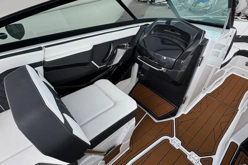 Slide: The Image of 2022 Monterey 258 Super Sport boat interior with sleek seating and modern dashboard design. - 17