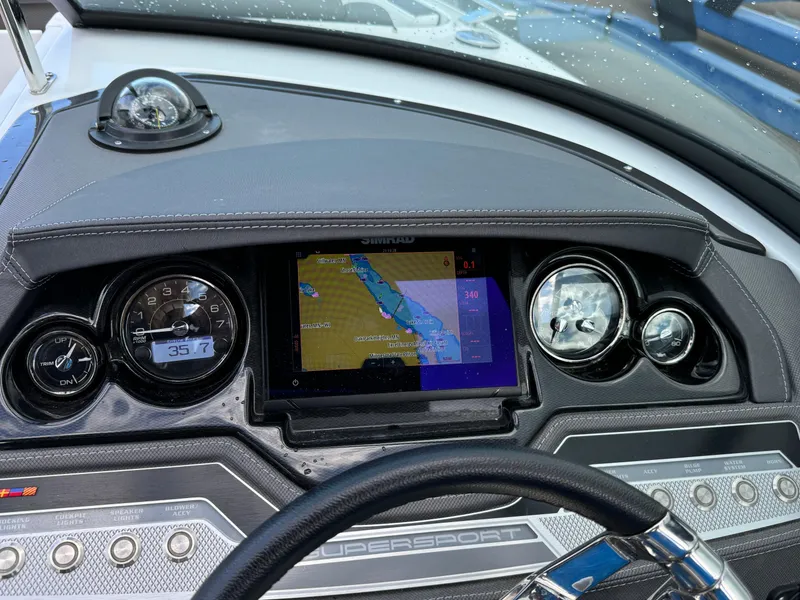 Slide: The Image of Dashboard of 2022 Monterey 258 Super Sport boat with navigation system and gauges. - 25