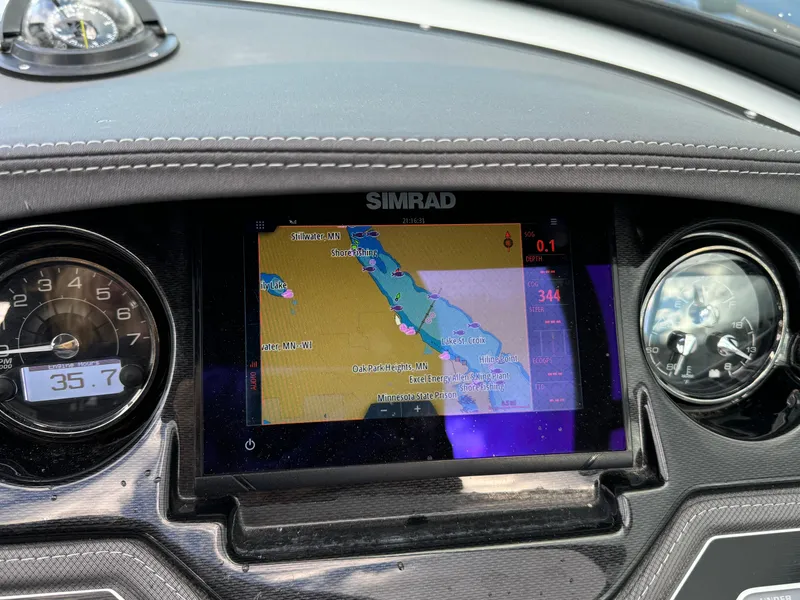 Slide: The Image of Dashboard of a 2022 Monterey 258 Super Sport with Simrad navigation display. - 26