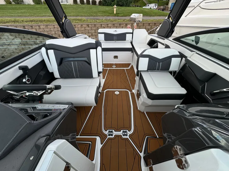 Slide: The Image of 2022 Monterey 258 Super Sport boat interior with sleek seating and modern design. - 37