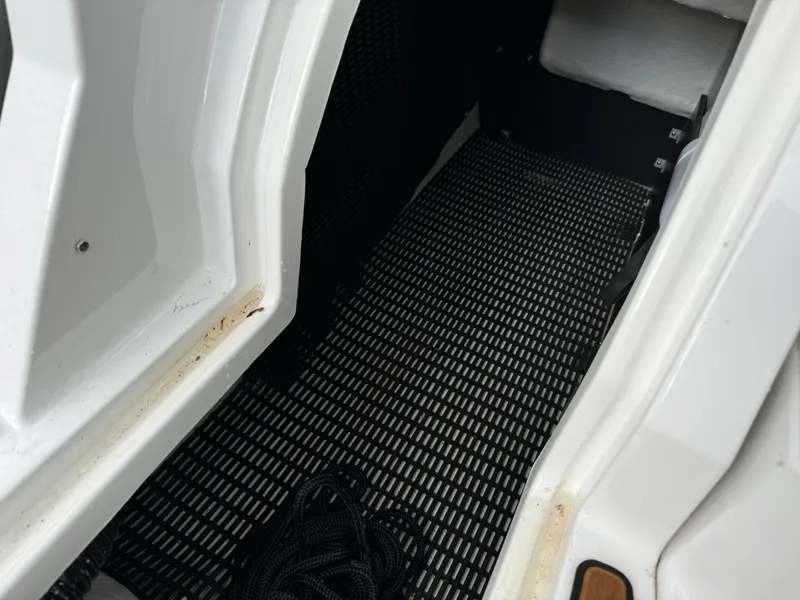Slide: The Image of Interior view of a 2022 Monterey 258 Super Sport boat, featuring a textured floor mat. - 8