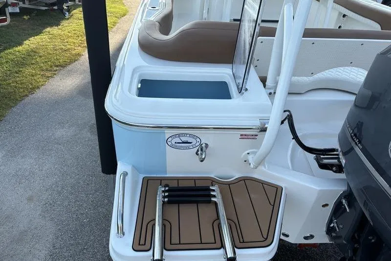 Slide: The Image of 2026 Pioneer Islander 222 boat with swim platform and seating area. - 11