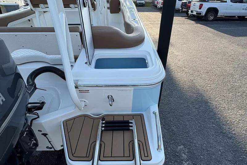 Slide: The Image of 2026 Pioneer Islander 222 boat with seating, motor, and swim platform. - 12