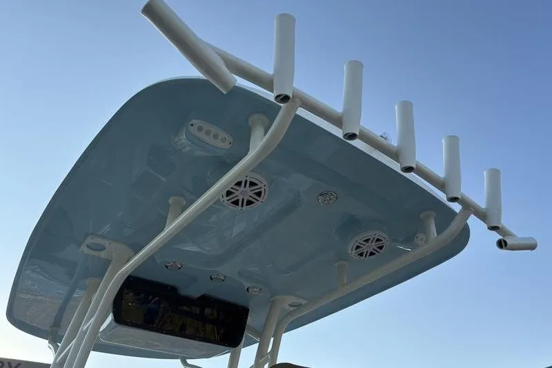 Slide: The Image of Pioneer Islander 222 boat roof with rod holders and speakers, 2026 model. - 17