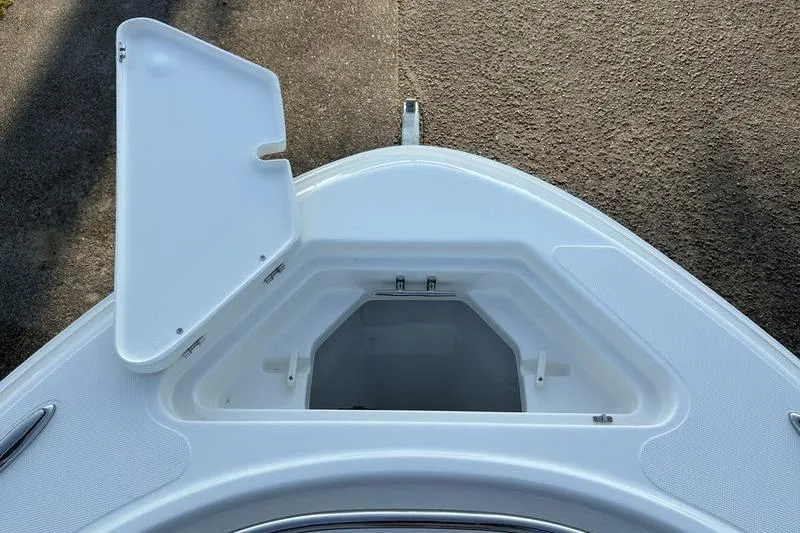 Slide: The Image of Open storage compartment on 2026 Pioneer Islander 222 boat deck. - 31