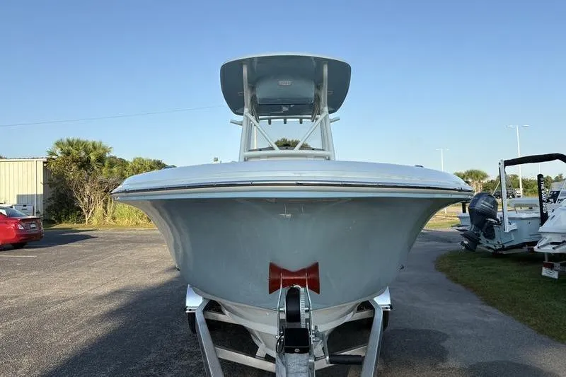 Slide: The Image of 2026 Pioneer Islander 222 boat on trailer, front view, clear sky background. - 7