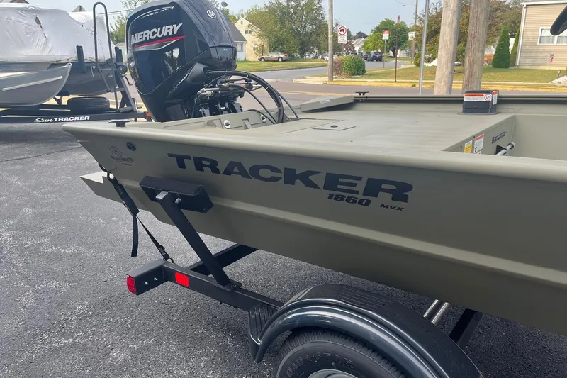 Slide: The Image of 2026 Tracker Grizzly 1860 CC boat with Mercury engine on trailer. - 4