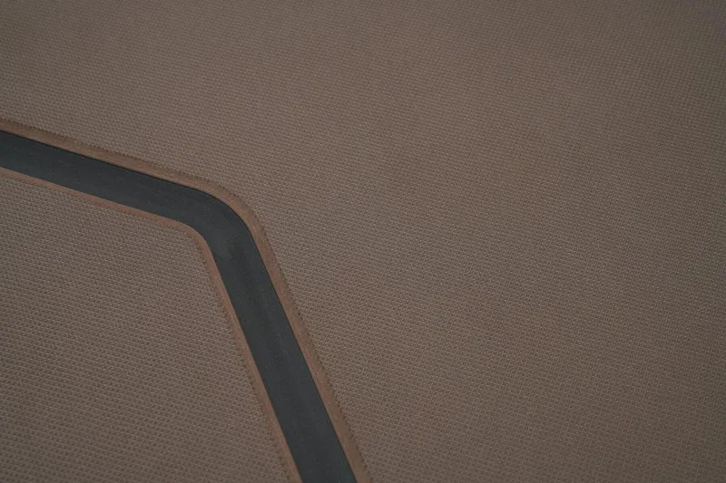 Slide: The Image of Brown textured surface with a black line, possibly a boat deck from a 2026 Tracker Grizzly 1860 CC. - 41