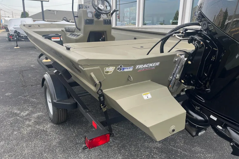 Slide: The Image of 2026 Tracker Grizzly 1860 CC boat on trailer, outdoor display. - 7