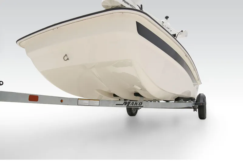 Slide: The Image of 2026 Mako Pro Skiff 17 CC boat on trailer, showcasing sleek hull design. - 22