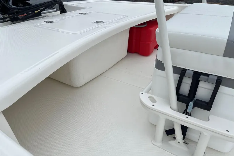 Slide: The Image of 2026 Mako Pro Skiff 17 CC interior with seating and storage compartments. - 6