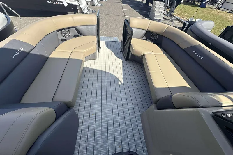 Slide: The Image of Luxurious seating on 2026 Viaggio x22u boat, featuring beige and gray upholstery. - 13