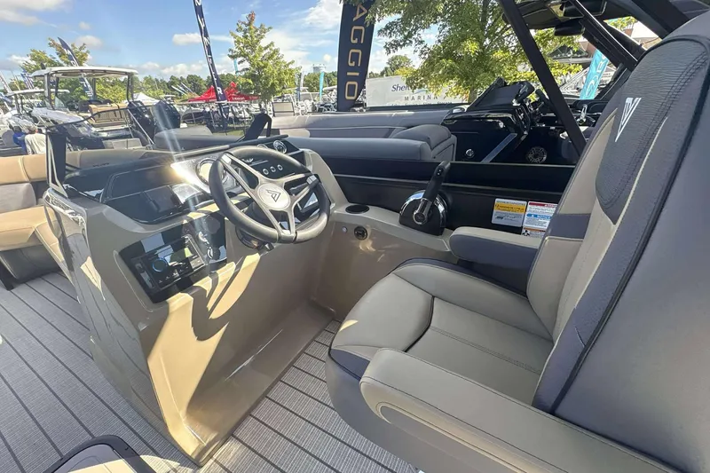 Slide: The Image of 2026 Viaggio x22u boat interior with steering wheel and seating, showcasing modern design. - 6