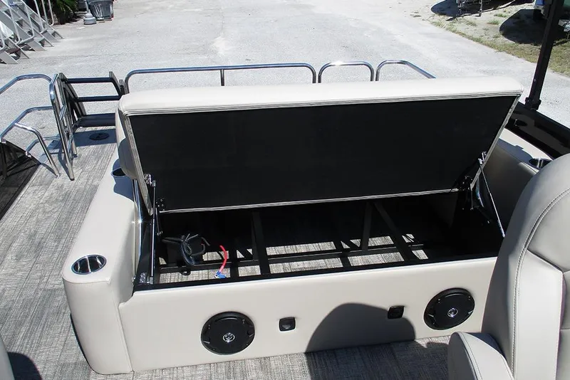 Slide: The Image of 2026 Bentley Pontoons 223 Legacy Swingback interior with open storage compartment. - 22