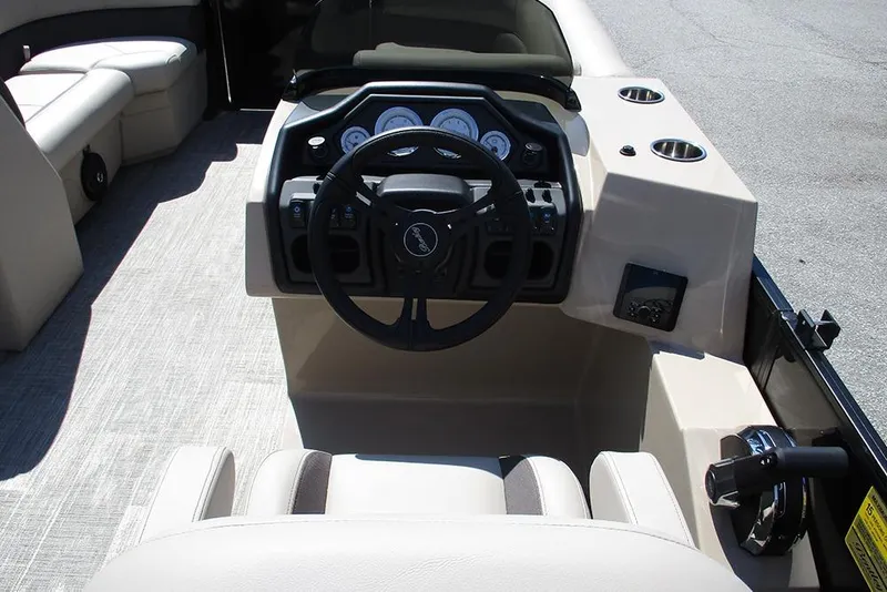 Slide: The Image of 2026 Bentley Pontoons 223 Legacy Swingback dashboard with steering wheel and controls. - 28