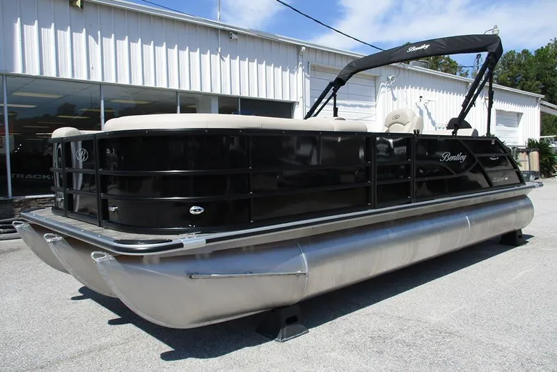 Slide: The Image of 2026 Bentley Pontoons 223 Legacy Swingback, sleek black design, parked outdoors. - 3