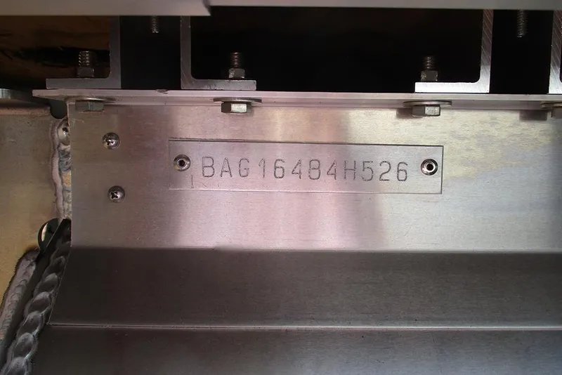 Slide: The Image of VIN plate on 2026 Bentley Pontoons 223 Legacy Swingback, displaying serial number BAG16484H526. - 30