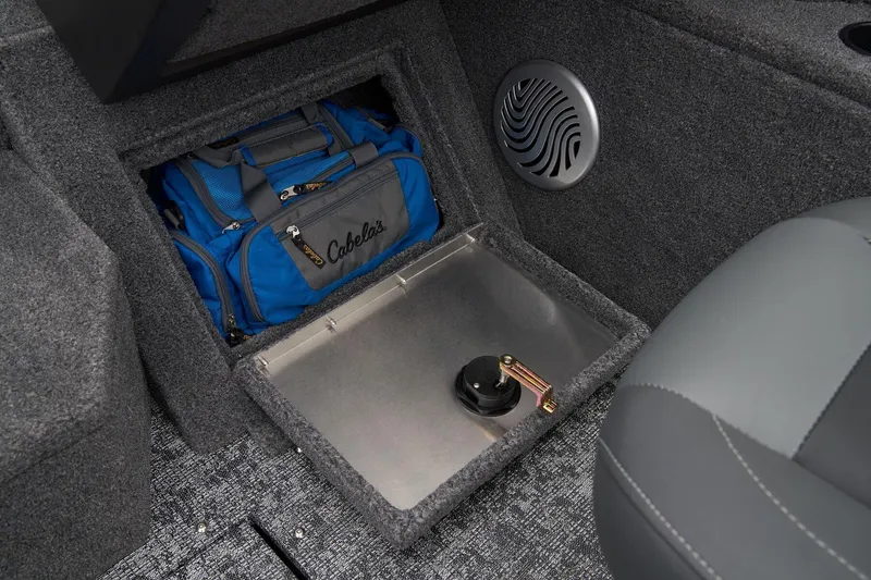 Slide: The Image of Manufacturer Provided Image: 2026 Tracker Pro Guide V-175 Combo storage compartment with blue bag and speaker. - 37
