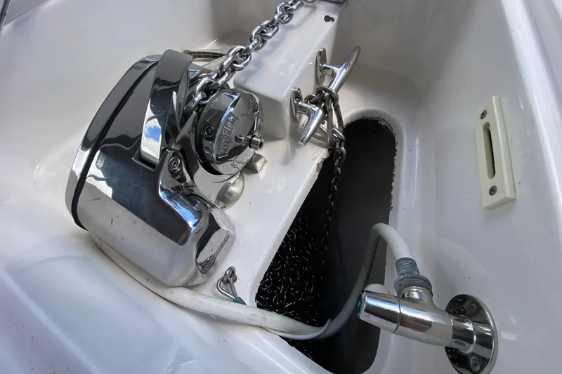 Slide: The Image of Anchor system on a 2015 Edgewater 320CC boat, featuring a polished metal finish. - 30