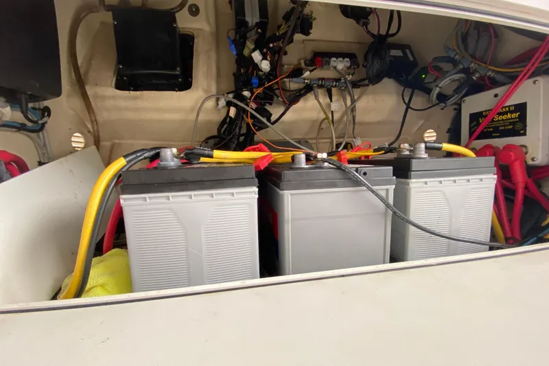 Slide: The Image of Battery compartment of a 2015 Edgewater 320CC boat with wiring and connections. - 36
