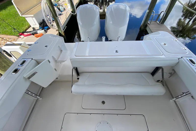 Slide: The Image of 2015 Edgewater 320CC boat interior with seating and storage compartments. - 8