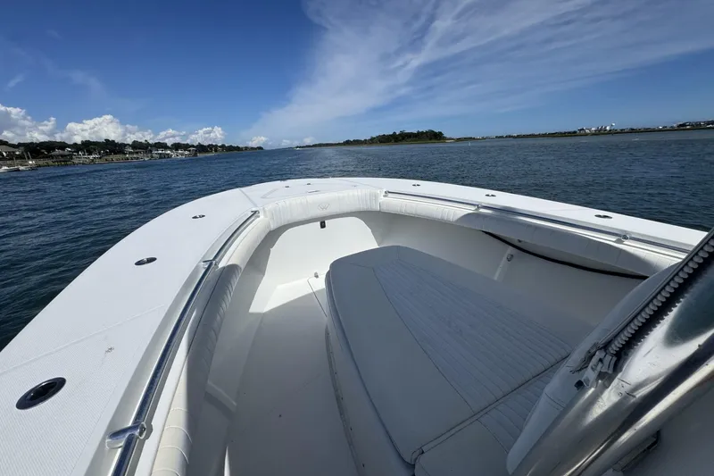 Slide: The Image of 2006 Southport 28 Center Console boat on calm waters under a clear blue sky. - 12