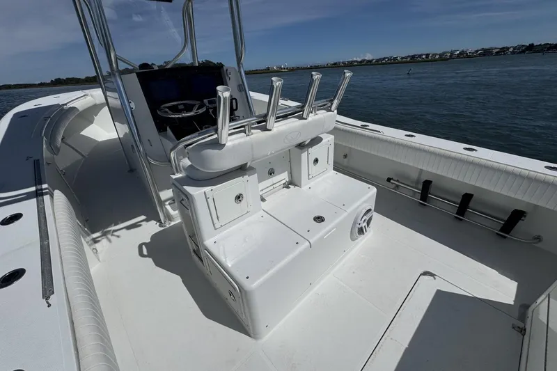 Slide: The Image of 2006 Southport 28 Center Console boat interior with rod holders and seating. - 19