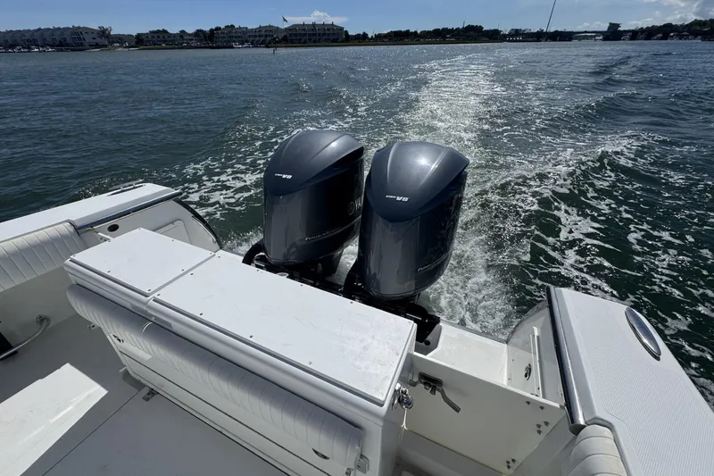 Slide: The Image of 2006 Southport 28 Center Console boat with dual engines cruising on open water. - 20
