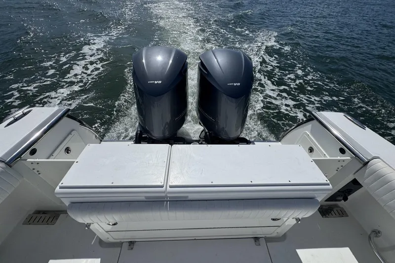 Slide: The Image of 2006 Southport 28 Center Console boat with dual engines cruising on water. - 21