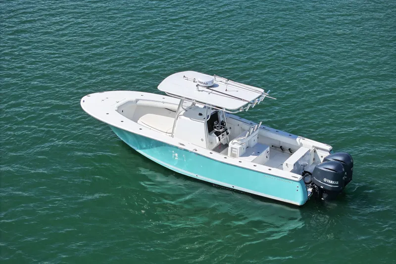 Slide: The Image of 2006 Southport 28 Center Console boat on clear blue water. - 3